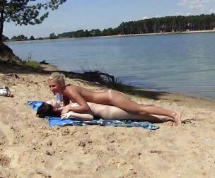 2 sizzling russian young getting a suntan on the free beach.