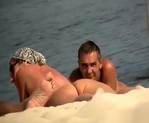 Hidden cam at naturist beach films naked dudes and nymph