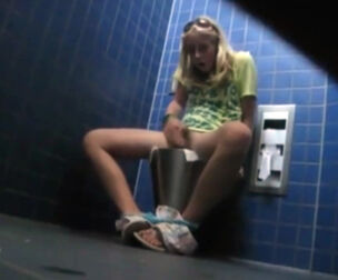 Unexperienced school coed draining in the wc and her