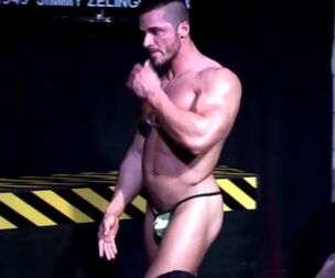 Bulky masculine stripper dancing for homo guys at closed